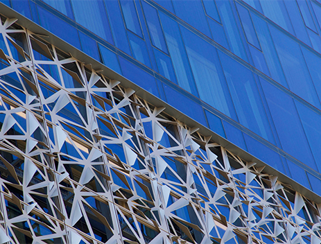 building-with-blue-background-that-has-large-window-that-says-it marco